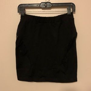 BEBE black skirt with see thru mesh slits size M